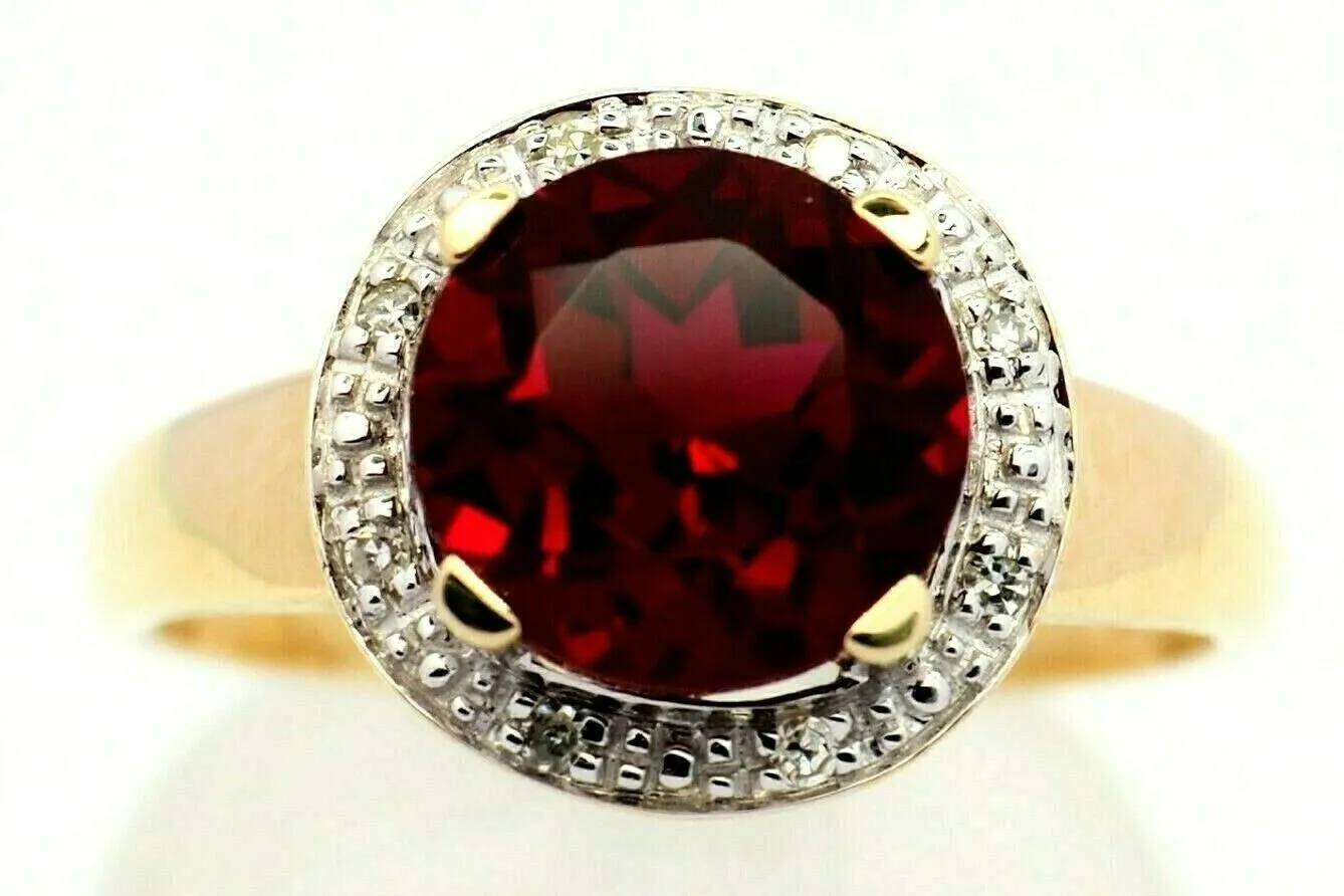 Ruby & Diamond 9ct Yellow Gold & Rhodium Plated Halo Ring