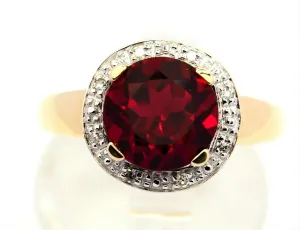 Ruby & Diamond 9ct Yellow Gold & Rhodium Plated Halo Ring